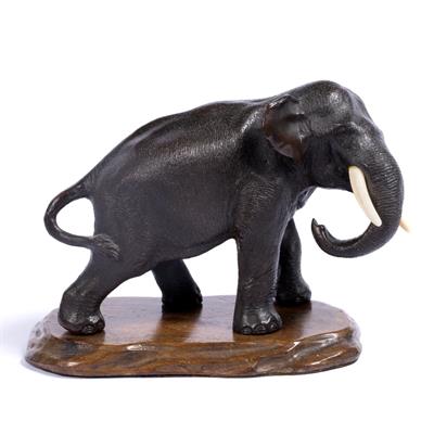 Lot 407 - Bronze model of a standing elephant with curled trunk