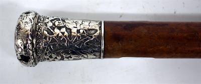 Lot 17 - AN OLD MALACCA WALKING CANE with Oriental white metal embossed silver finial 91cm long