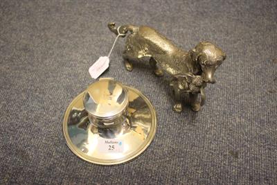 Lot 25 - A SILVER CAPSTAN INK STAND of tapering circular form with hinged lid and reeded decoration