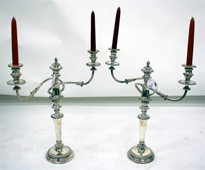 Lot 29 - A PAIR OF SILVER PLATED TWO BRANCH CANDELABRA with gadrooned drip pans