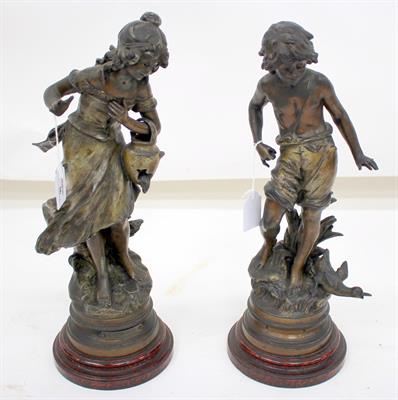 Lot 36 - A PAIR OF BRONZED 19TH CENTURY SPELTER FIGURES of a boy and a girl on turned socles 35.5cm high