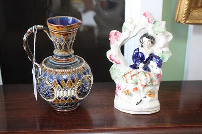 Lot 43 - A DOULTON LAMBETH STONEWARE JUG with blue and mottled green glaze stamped to the underside H. H. and