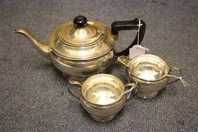 Lot 47 - A 20TH CENTURY SILVER THREE PIECE TEASET the teapot engraved A & H.D. 1912 - 1939