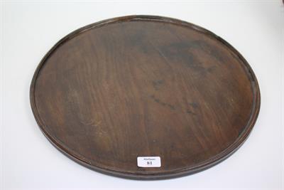 Lot 81 - A GEORGIAN CIRCULAR MAHOGANY SALVER with moulded edge