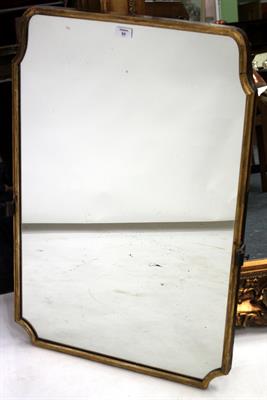 Lot 84 - A REGENCY GILT FRAMED WALL MIRROR with shaped rectangular plate and moulded frame 57cm x 87cm