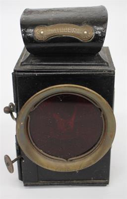 Lot 87 - AN OLD BLACK PAINTED MILLER VEHICLE LAMP 17.5cm high