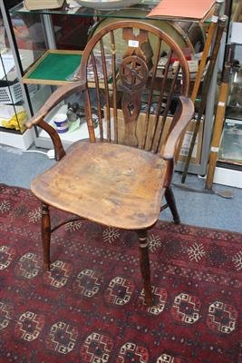 Lot 105 - A 19TH CENTURY YEW AND ELM WINDSOR WHEELBACK ARMCHAIR