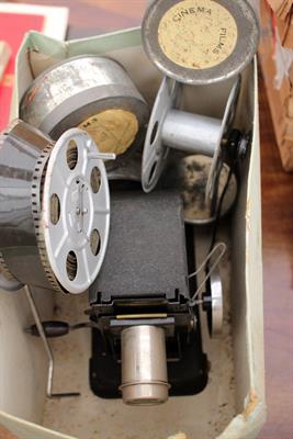 Lot 111 - AN EARLY 20TH CENTURY BING CINE PROJECTOR together with three Givjoy comedy films to include Charlie