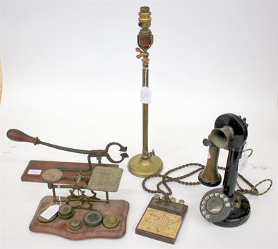 Lot 137 - AN OLD BLACK LACQUERED CANDLESTICK TYPE TELEPHONE set up as a telephone demonstration set together