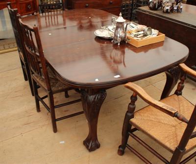 Lot 170 - A VICTORIAN MAHOGANY WIND-OUT DINING TABLE with cabriole legs terminating in claw and ball feet (two