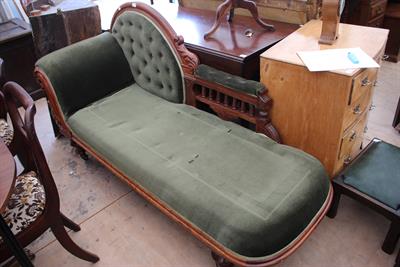 Lot 173 - A VICTORIAN WALNUT FRAMED GREEN UPHOLSTERED CHAISE LONGUE with turned feet terminating in casters