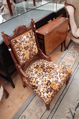 Lot 174 - A LATE VICTORIAN UPHOLSTERED LOW CHAIR together with a Victorian mahogany Sutherland table