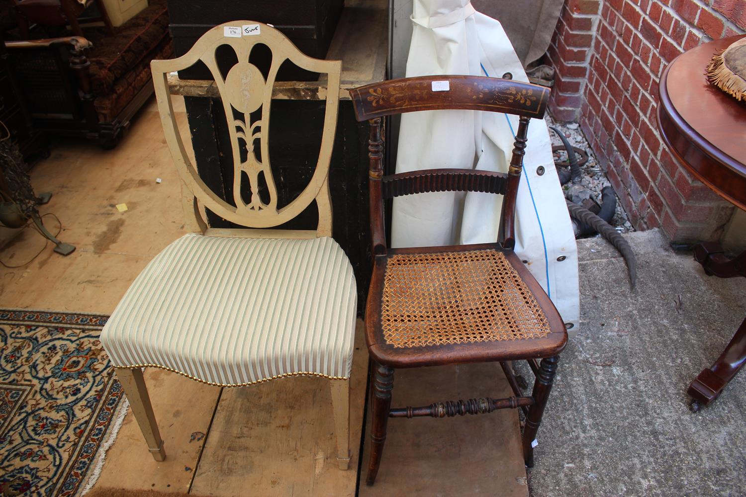 Lot 176 - A LATE 19TH CENTURY CREAM PAINTED SHIELD BACK DINING CHAIR with upholstered seat and square tapering