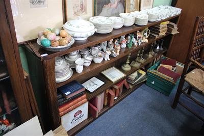 Lot 177 - A LONG OAK OPEN FRONT BOOKCASE with two fixed shelves