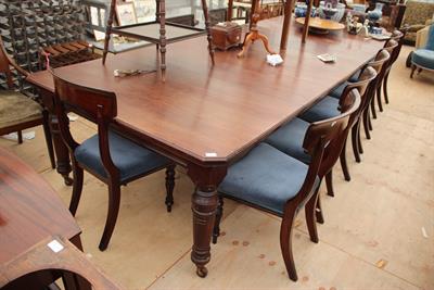 Lot 244 - A VICTORIAN MAHOGANY EXTENDING DINING TABLE with turned tapering legs terminating in ceramic castors