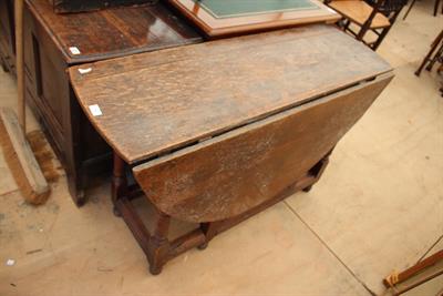 Lot 251 - AN ANTIQUE OAK OVAL GATELEG TABLE with ringturned legs 120.5cm wide