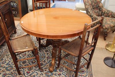 Lot 256 - A CIRCULAR MAHOGANY BREAKFAST TABLE the tilt top on carved tripod base
