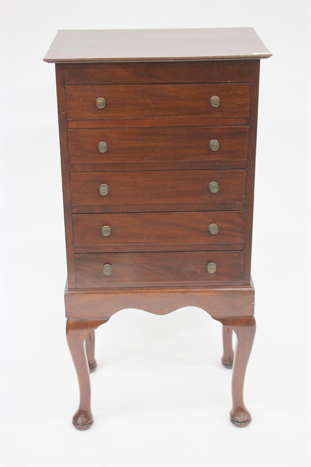 Lot 261 - A MAHOGANY MUSIC CABINET fitted five long drawers with fall fronts