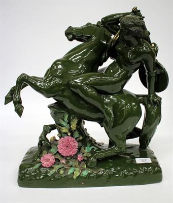 Lot 267 - A CONTINENTAL PORCELAIN GREEN GLAZED REARING HORSE with semi clad maiden on its back