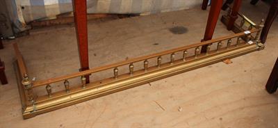 Lot 275 - A BRASS FENDER with urn finials 138cm wide
