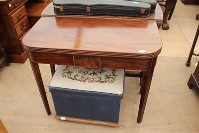 Lot 308 - A GEORGIAN MAHOGANY FOLD OVER TEA TABLE with rounded front corners and square tapering fluted legs