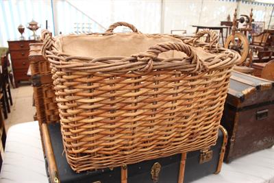 Lot 312 - A RECTANGULAR WICKER BASKET with four handles and hessian lined interior 49cm wide x 52.5cm high