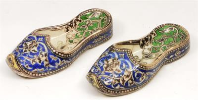 Lot 335 - A PAIR OF LATE 19TH CENTURY QUAJAR POTTERY SLIPPERS each with the underglaze painted in cobolt green