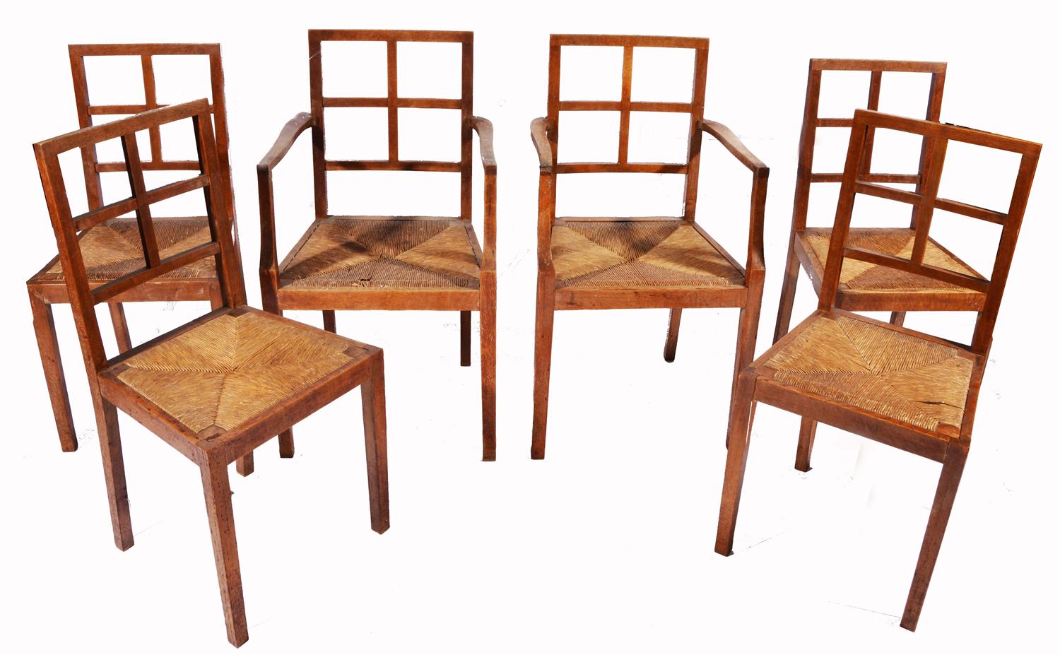 Lot 376 - A SET OF SIX OAK HEALS STYLE ARTS & CRAFTS DINING CHAIRS with rush seats and square tapering legs (2
