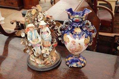 Lot 392 - A VICTORIAN DIORAMA two porcelain figures within a flowery bower