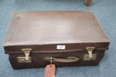 Lot 395 - AN OLD SUITCASE containing a number of watch makers parts and tools