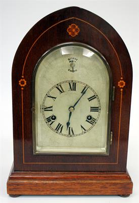 Lot 399 - AN EDWARDIAN MAHOGANY CASED DOME TOPPED MANTLE CLOCK the engraved silvered dial with black Roman