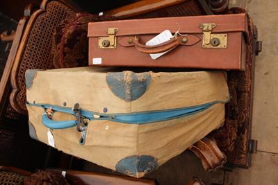Lot 431 - AN AMBER BLUE LEATHERETTE TRAVELLING SUITCASE with original canvas cover together with a further