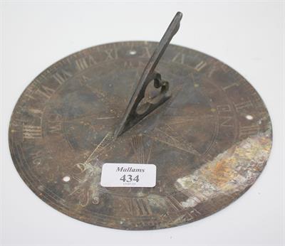Lot 434 - A CIRCULAR BRASS SUNDIAL PLATE with pierced gnomen