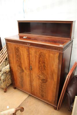 Lot 438 - AN EDWARDIAN MAHOGANY CUPBOARD with raised bookshelf back