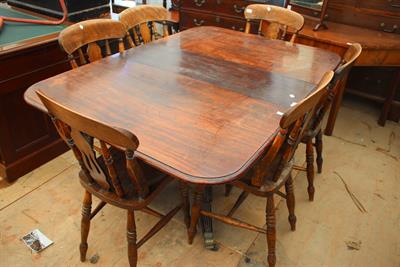 Lot 445 - A 19TH CENTURY MAHOGANY DRAWER LEAF DINING TABLE on central turned column support