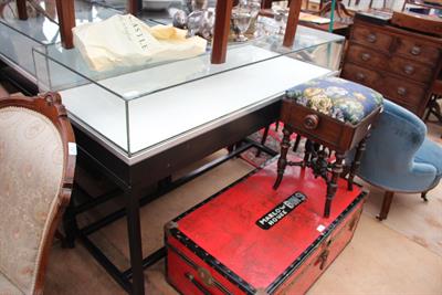 Lot 448 - A GLASS TOPPED BLACK PAINTED TABLE TOP DISPLAY CABINET with iron framed base