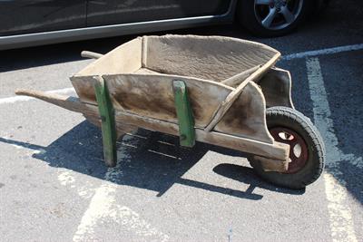 Lot 494 - AN OLD ELM WHEELBARROW approximately 156cm long overall