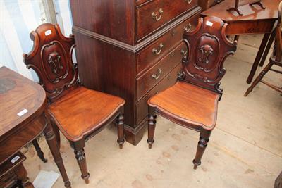 Lot 498 - A PAIR OF VICTORIAN MAHOGANY SHIELD BACKED HALL CHAIRS with turned tapering front legs 43.5cm wide