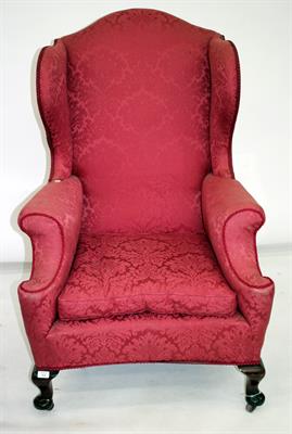 Lot 504 - A GEORGIAN STYLE WING BACK UPHOLSTERED ARMCHAIR