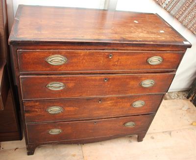 Lot 522 - A 19TH CENTURY MAHOGANY CHEST of four long drawers with brass navette shaped handles on splayed