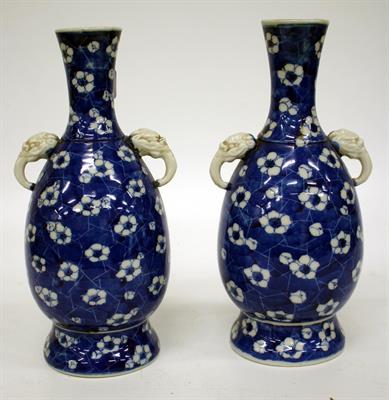 Lot 550 - A PAIR OF LATE 19TH/EARLY 20TH CENTURY CHINESE BLUE AND WHITE PRUNUS BLOSSOM TWIN HANDLED BOTTLE
