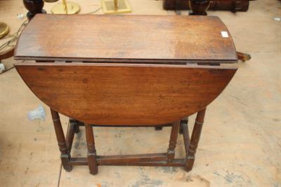 Lot 554 - AN 18TH CENTURY OAK GATELEG TABLE with turned supports
