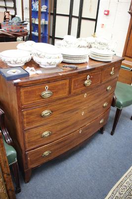 Lot 559 - A VICTORIAN MAHOGANY BOW FRONTED CHEST of three short and three long drawers with brass handles and