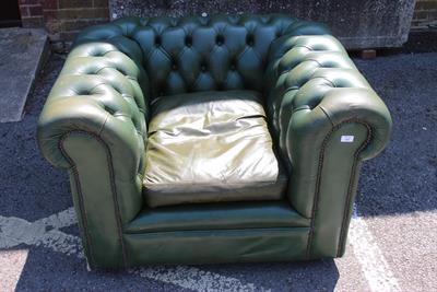 Lot 568 - A GREEN LEATHER BUTTON UPHOLSTERED CHESTERFIELD TYPE ARMCHAIR 106cm wide