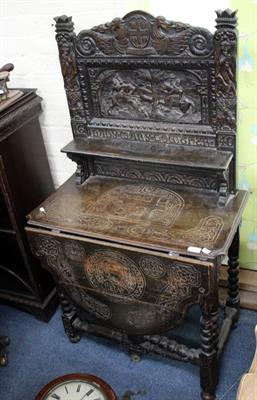 Lot 582 - AN ANTIQUE OAK DROP LEAF TABLE with heavily carved back panel on bobbin turned supports