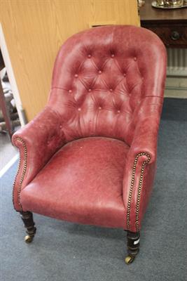 Lot 591 - A VICTORIAN RED LEATHER BUTTON UPHOLSTERED ARMCHAIR with scrolling arms and turned tapering front