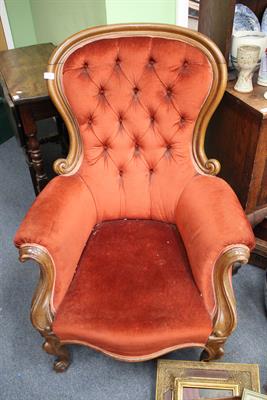 Lot 595 - A VICTORIAN MAHOGANY ARMCHAIR with shaped button upholstered back