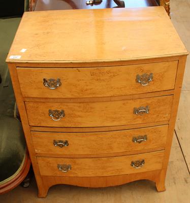Lot 620 - A SMALL MAPLE WOOD VENEERED BOW FRONTED CHEST of four long drawers
