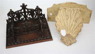 Lot 629 - A CARVED BLACK FOREST WALL BRACKET with vine leaf decoration