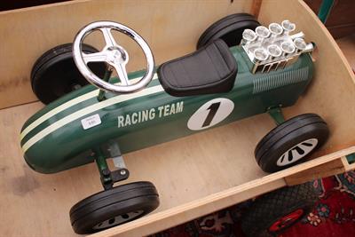 Lot 646 - THE RACING TEAM' A RIDE ON TIN PLATE CHILD'S TOY CAR in British racing green 72cm long